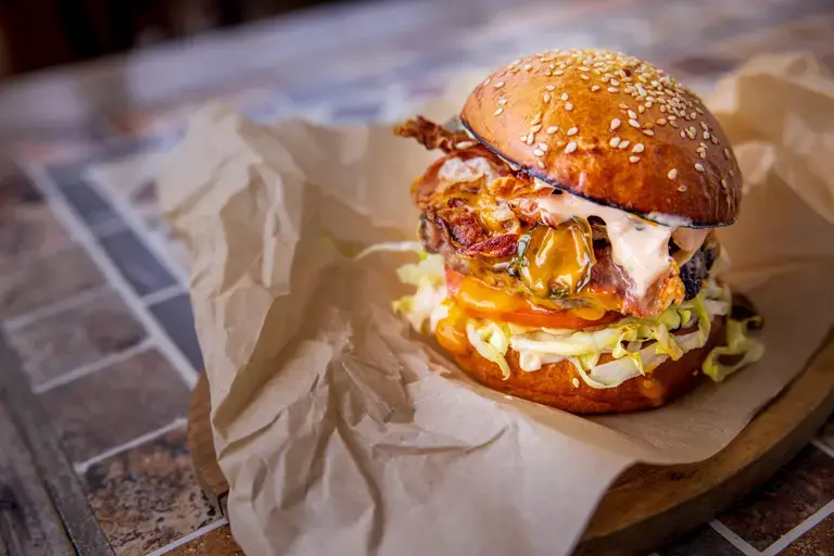 Beef burger with onions and jalapeños